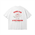 Back of white heavyweight t-shirt featuring a retro cartoon mascot of a walking tagine with sunglasses, 'TAGINE CLUB' red text, and 'LE PETIT MAROCAIN' branding, vintage streetwear fit.
