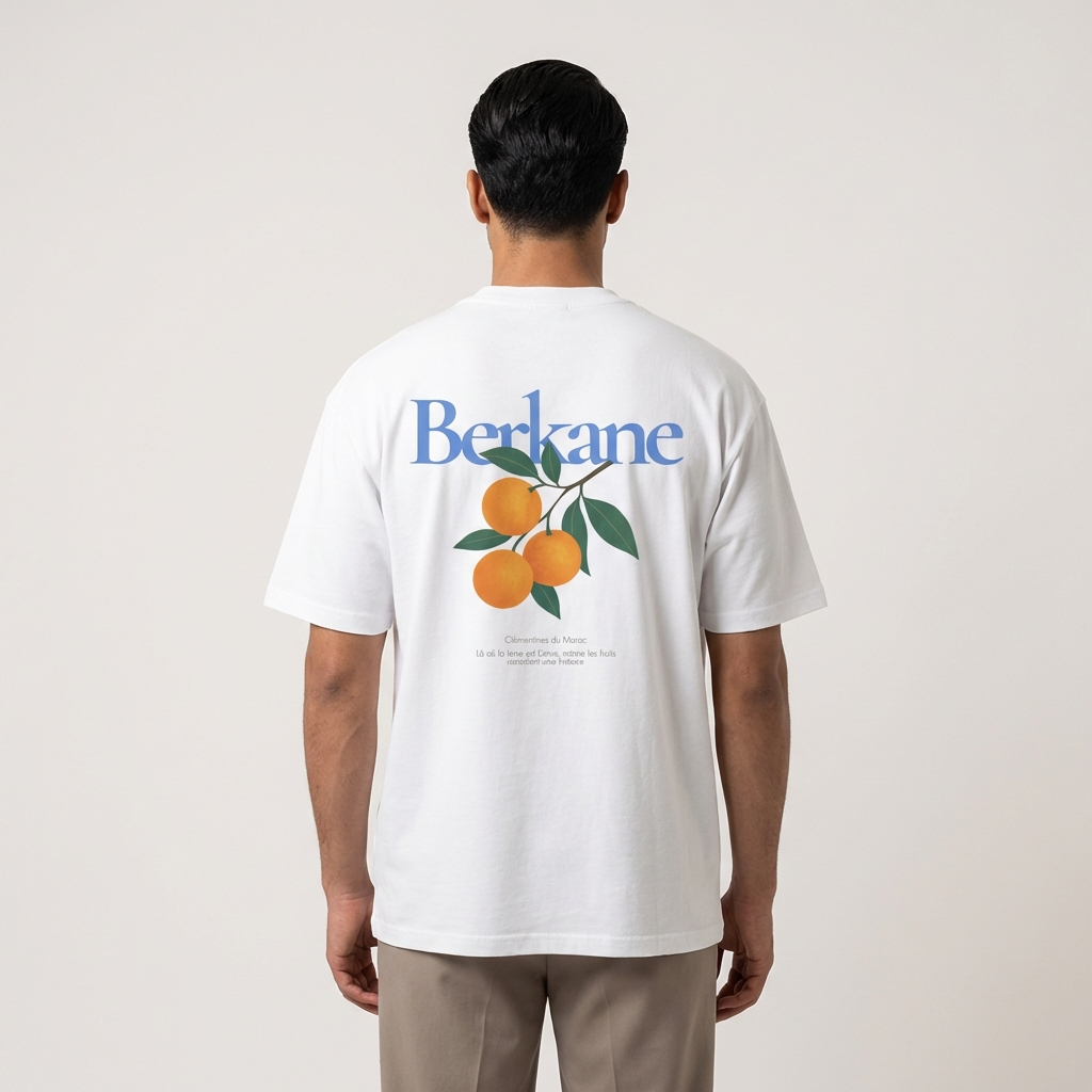 Back view of Berkane orange citrus inspired graphic t-shirt standing against a plain background.