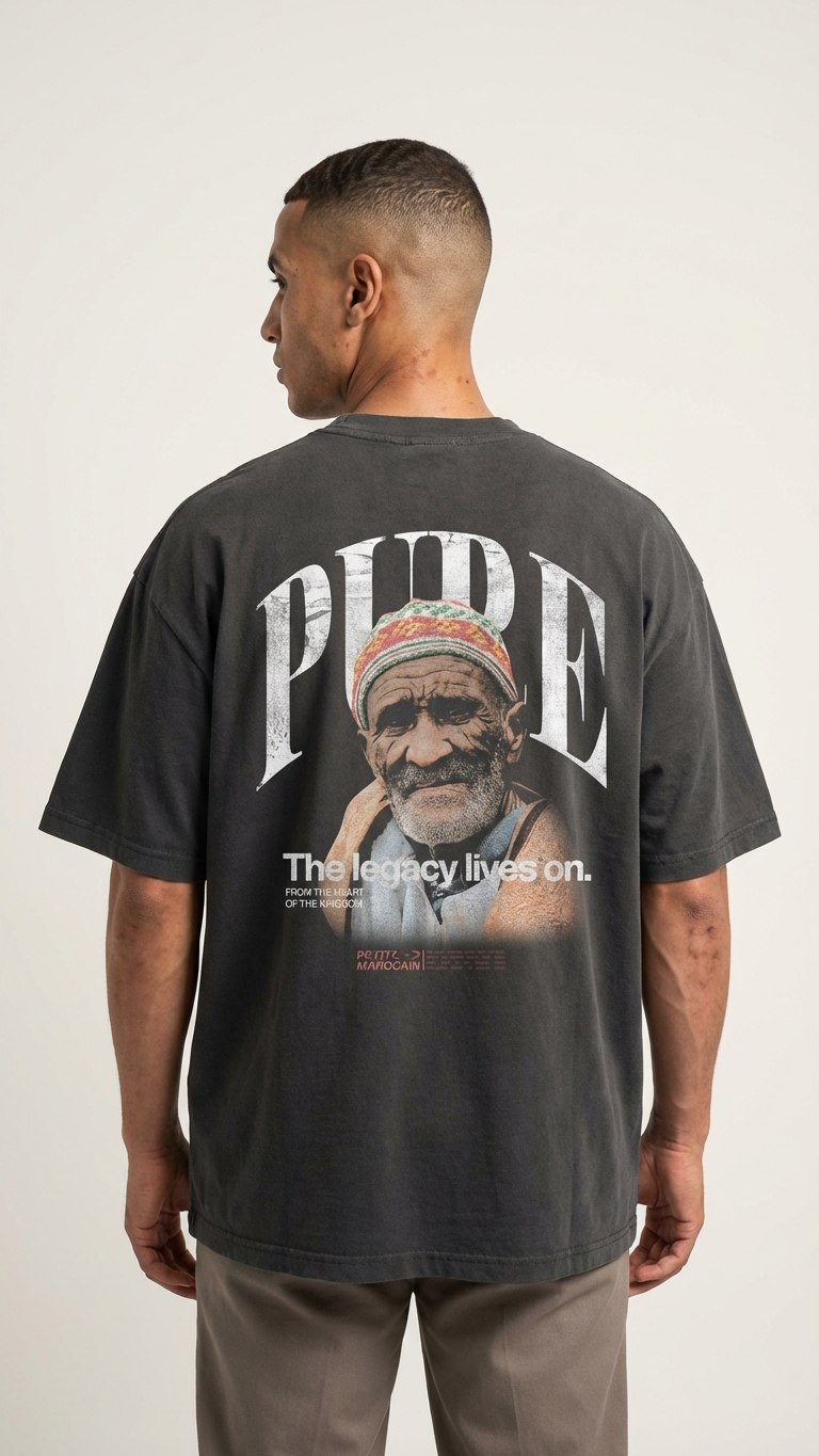 Man wearing the Chibani portrait graphic on premium heavyweight t-shirt, cinematic Moroccan streetwear style, boxy fit and standing against a plain background.