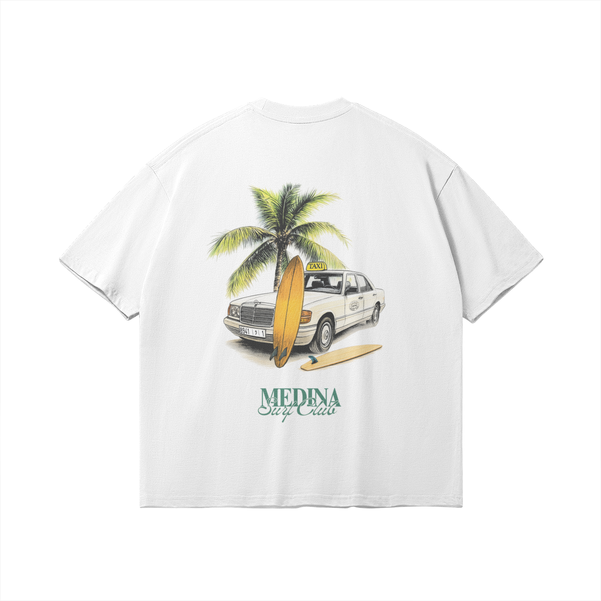 Back of white graphic tee featuring a vintage Grand Taxi Mercedes illustration with a palm tree and surfboards, 'Medina Surf Club' typography, retro Moroccan vibe.