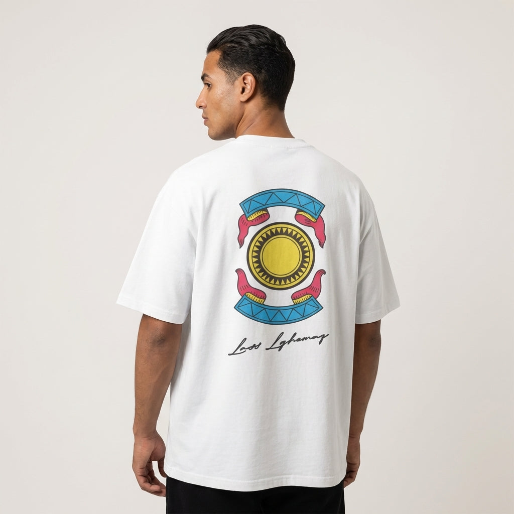 Person wearing a white t-shirt with a colorful graphic on the back against a plain background