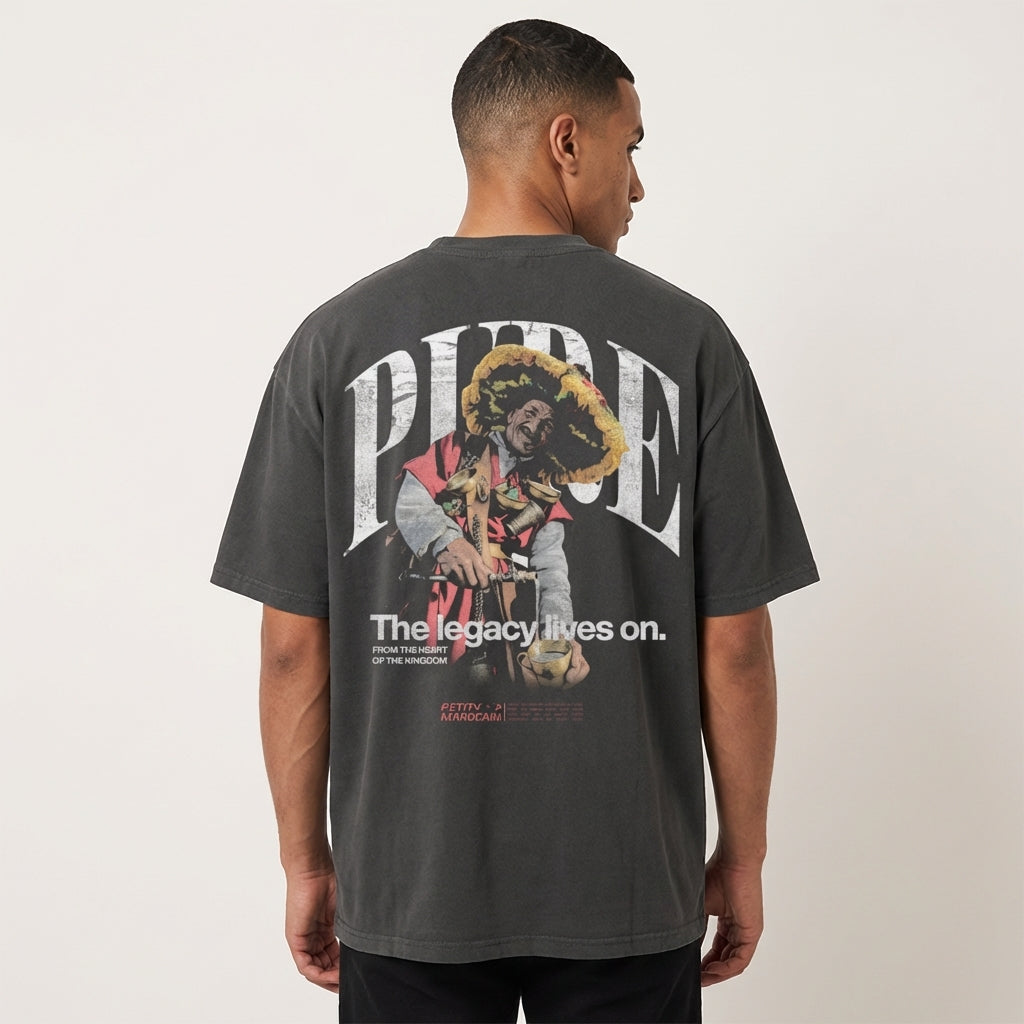 Man wearing wearing a Guerrab traditional water seller graphic on premium black t-shirt, standing against a plain background.